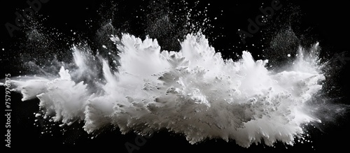 Dynamic Flow of White Powder Exploding Dramatically on a Dark Background