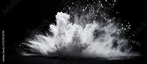 Dynamic White Powder Explosion Creating Abstract Patterns on Black Background
