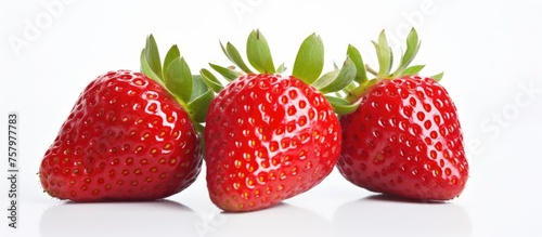 Vibrant Trio of Ripe Juicy Strawberries on Clean White Background