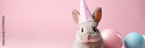 Happy Easter Bunny on pastel pink background.