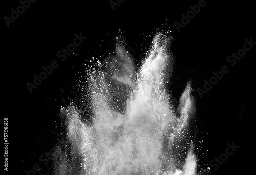 white powder explosion on black background. Colored burst cloud. Color dust explode. Paint Holi