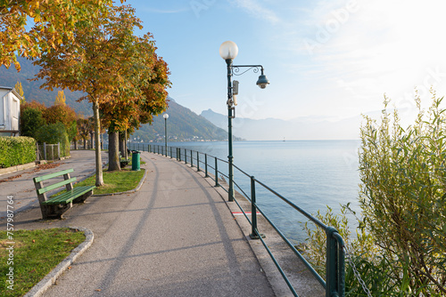 autumnal walkway lake Traunsee promenade with benches and chestnut trees © SusaZoom