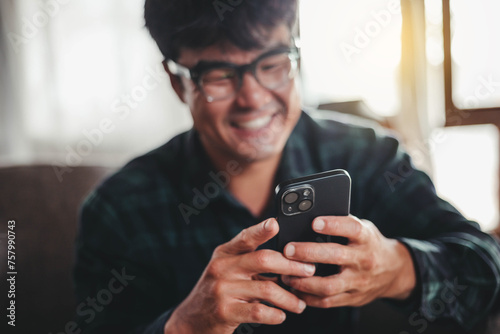 man using cell phone hand holding mobile texting message contact us.chatting,search internet information.technology device communication connecting