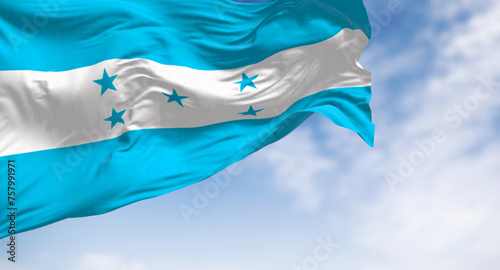 Flag of Honduras waving against a clear sky