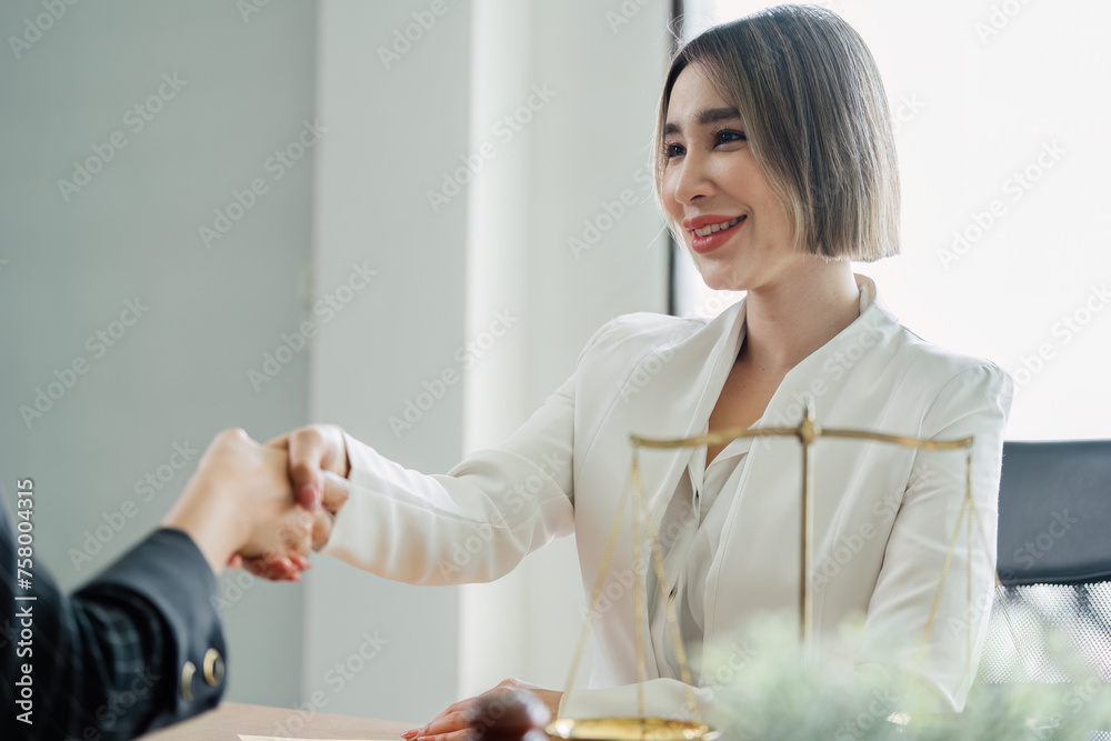Lawyer handshake with a client making about documents, contracts, agreements, cooperation agreement Lawyer handshake with a client making about documents, contracts, agreements, cooperation agreement
