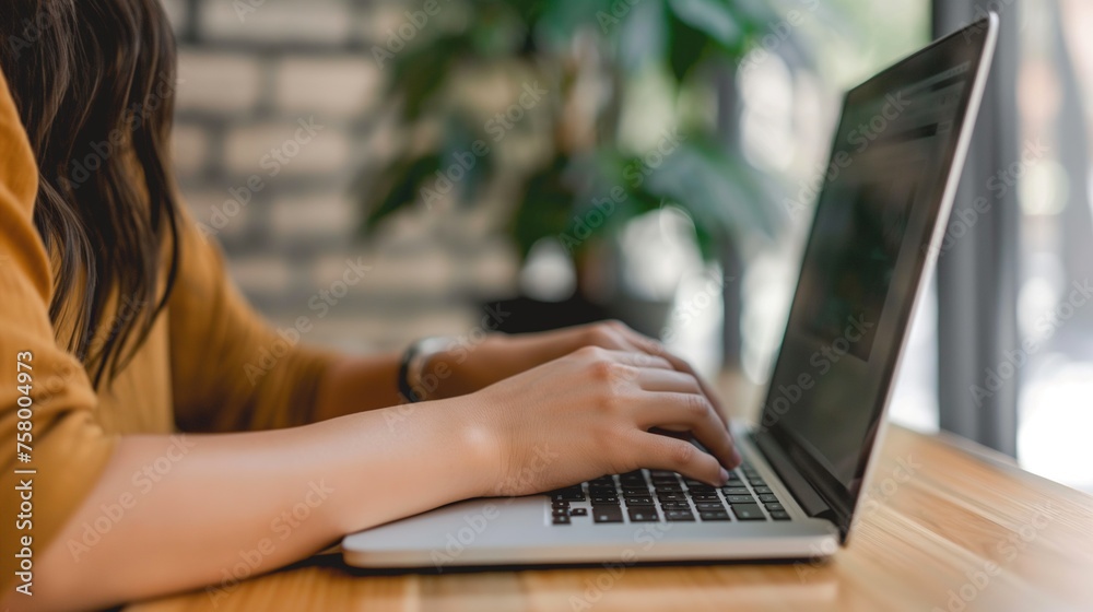 A woman freelancer working on laptop from home, cozy home office digital nomad. Business online A woman freelancer working on laptop from home, cozy home office digital nomad. Business online