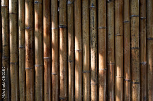 An image of a wall made of bamboo. 