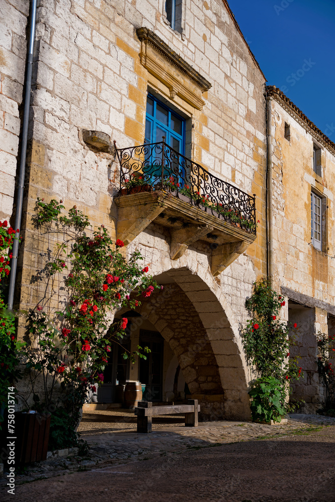 Beautiful stone house with blue shutters and balcony in Monpazier, Dordogne, Nouvelle-Aquitaine