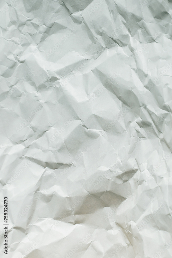 Obraz premium Crumpled white paper background.
