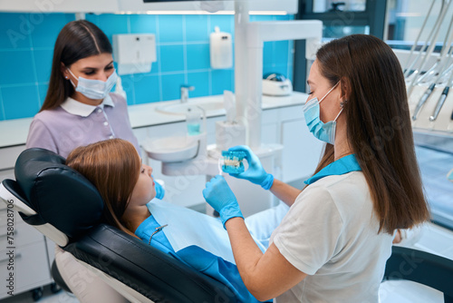 Girl at a dentists appointment in a modern clinic