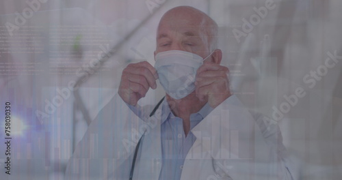 Image of data processing over caucasian male doctor with face mask