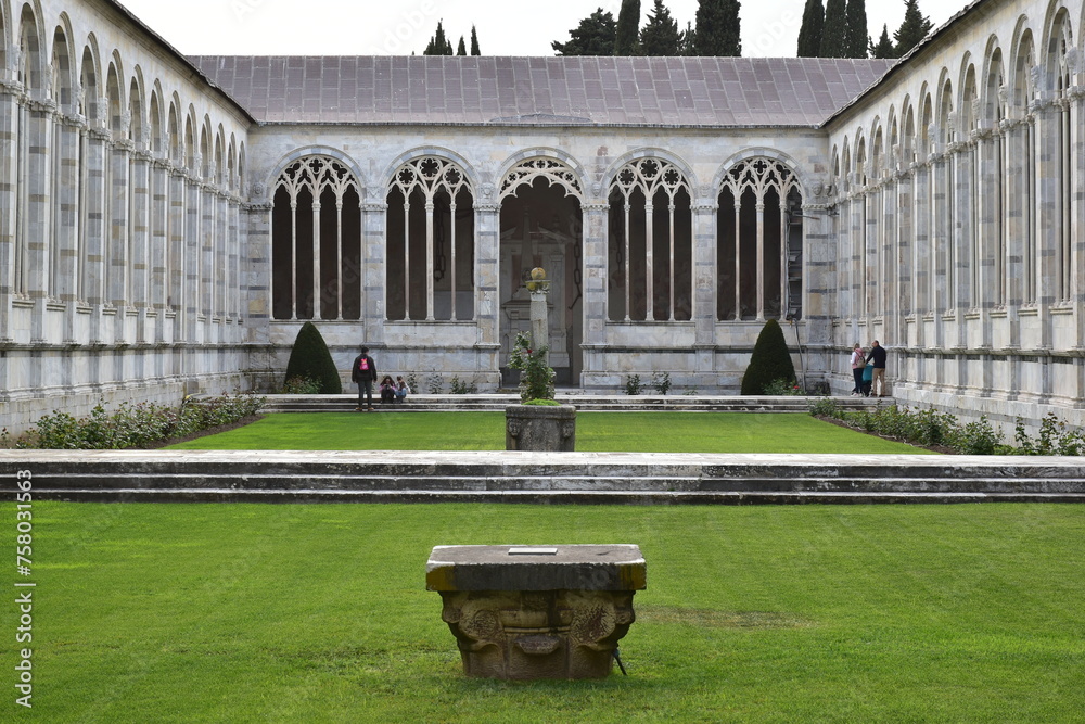The Camposanto is the last monument on Piazza del Duomo, its long marble wall flanking the northern boundary and completing its shape, Pisa. Italia