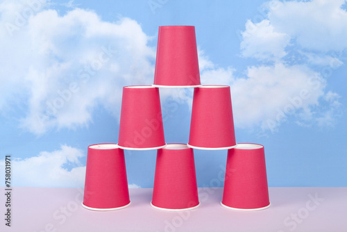 a pyramid of red disposable paper cups