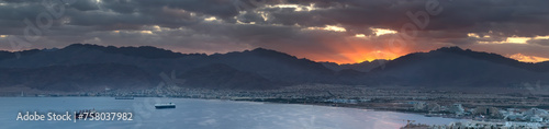 Panoramic morning view on Eilat (Israel) and Aqaba (Jordan) cities seen from surrounding hills in Eilat 

