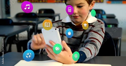 Image of colorful icons over caucasian schoolboy using smartphone