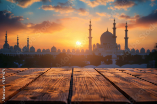 Empty wooden table and blurred mosque background