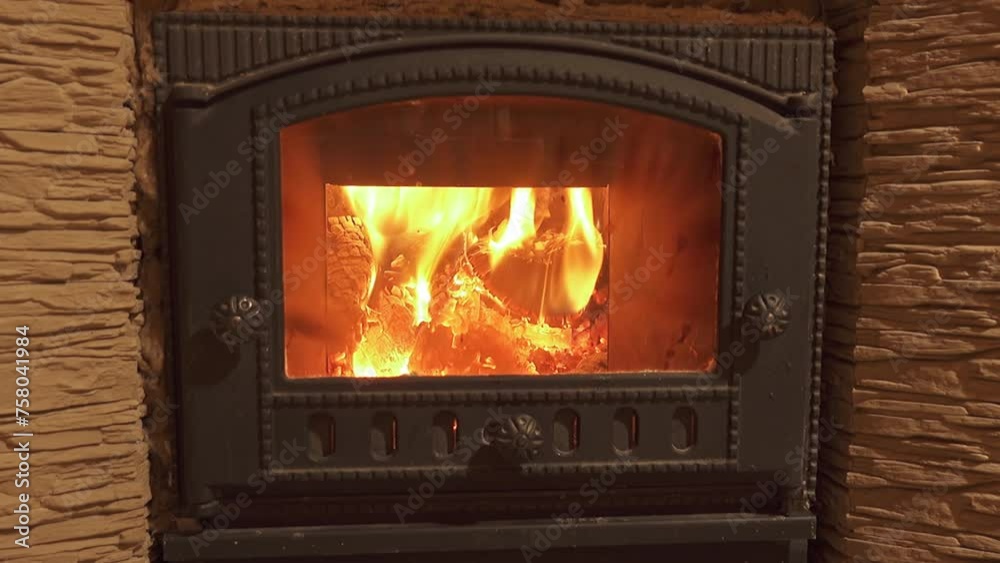 a fire is burning in a beautiful old fireplace a fire is burning in a beautiful old fireplace