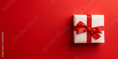 luxury gift box with silk and ribbon red background copy space © pickypix