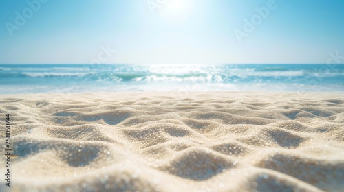 Close-up, empty sand with blurred beach background