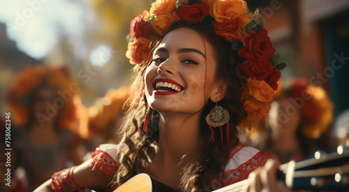 Happy woman Mariachi musician playing guitar at Cinco de Mayo festival.Cinco De Mayo - Mexico's national holiday