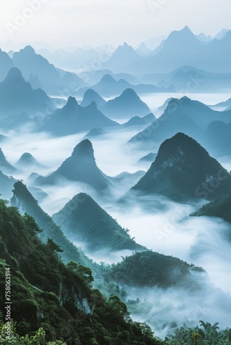 Pearl mist mountains in the early morning with soft pearlescent mist enveloping the peaks and valleys creating a serene landscape