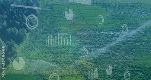 Image of multiple screens with data processing against aerial view of grassland