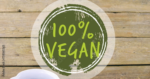 Image of 100 percent vegan text over bowl of fresh fruit