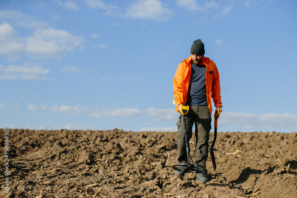 Man with a metal detector in the field. Search for treasures. Man with a metal detector in the field. Search for treasures.