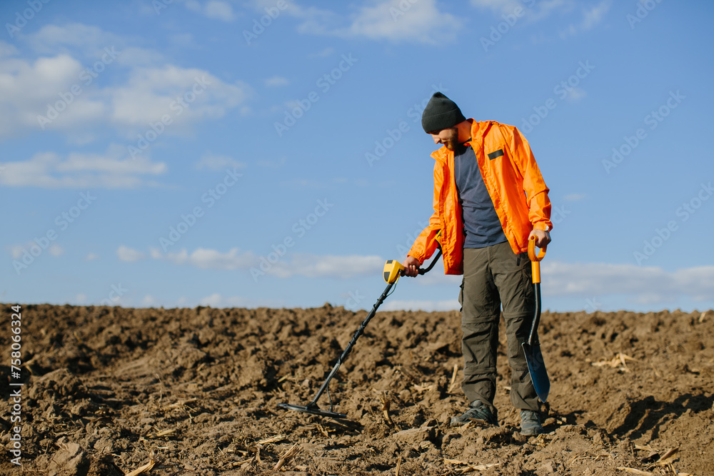 Man with a metal detector in the field. Search for treasures. Man with a metal detector in the field. Search for treasures.