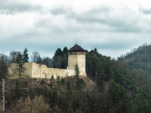 Restored ruins of a medieval castle from the 14th century in Muszyna over the Poprad River.