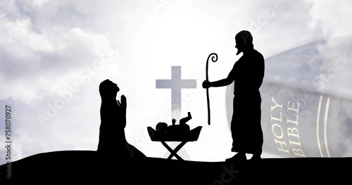 Image of christmas nativity scene and bible on clouds background