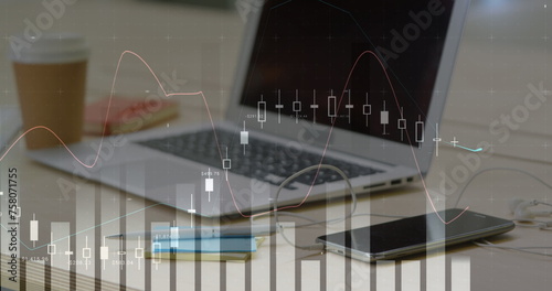 Digital image of graphs moving in the screen with a background of a work space with a laptop, smart 
