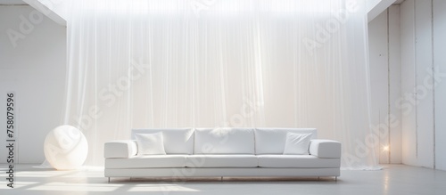 White couch in a well-lit space © Vusal