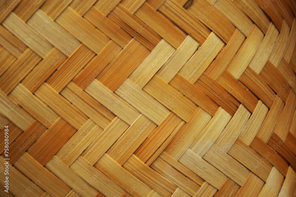 Fragment of a wicker beige basket, furniture. Abstract background with texture. Fragment of a wicker beige basket, furniture. Abstract background with texture.