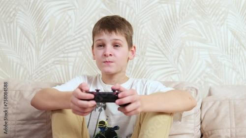 Young gamer managing PS. Home game console, modern technology, games, entertainment. photo