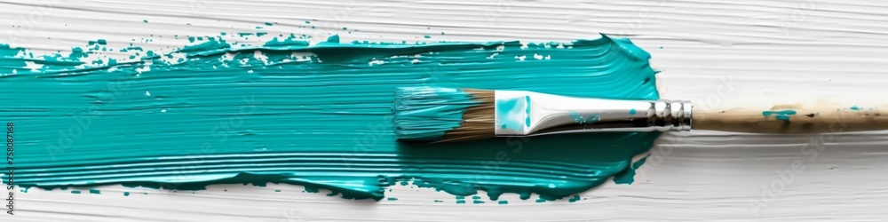 Obraz premium Paintbrush with dripping aqua blue paint isolated over white background.
