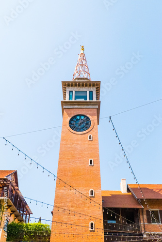 Old Clock Tower with blue sky at One Nimman Community Mall. photo