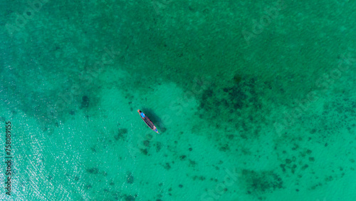 Traditional Thai longtail boat in turquoise waters of Andaman Sea. Khao Lak, Thailand. 