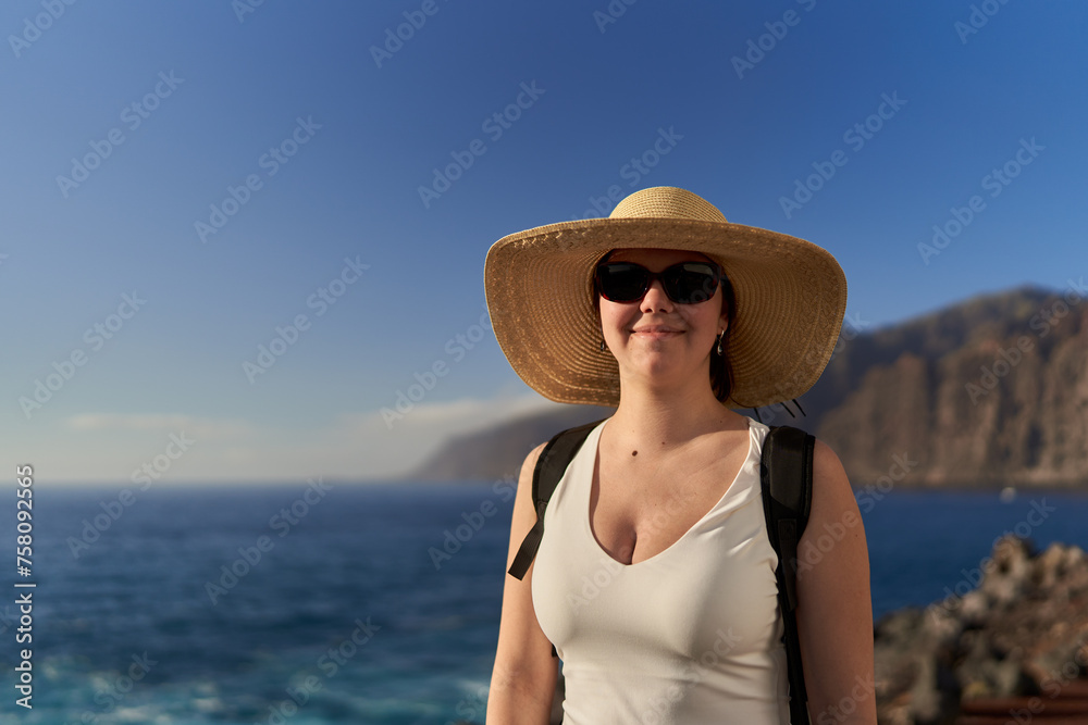 Young happy woman in Tenerife on the shore