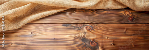 a wooden table with burlap fabric . Web banner with copy space . top view, 