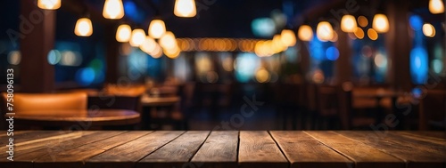 Empty wooden table top with lights bokeh on blur restaurant background © SR Production