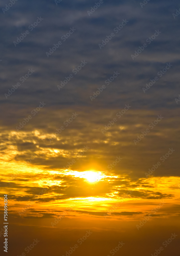 Sky with cirrus clouds and bright sunrise. Vertical photo Sky with cirrus clouds and bright sunrise. Vertical photo