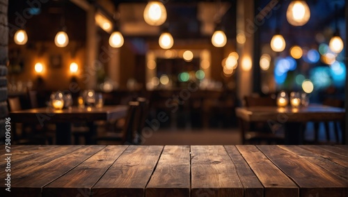 Empty wooden table top with lights bokeh on blur restaurant background