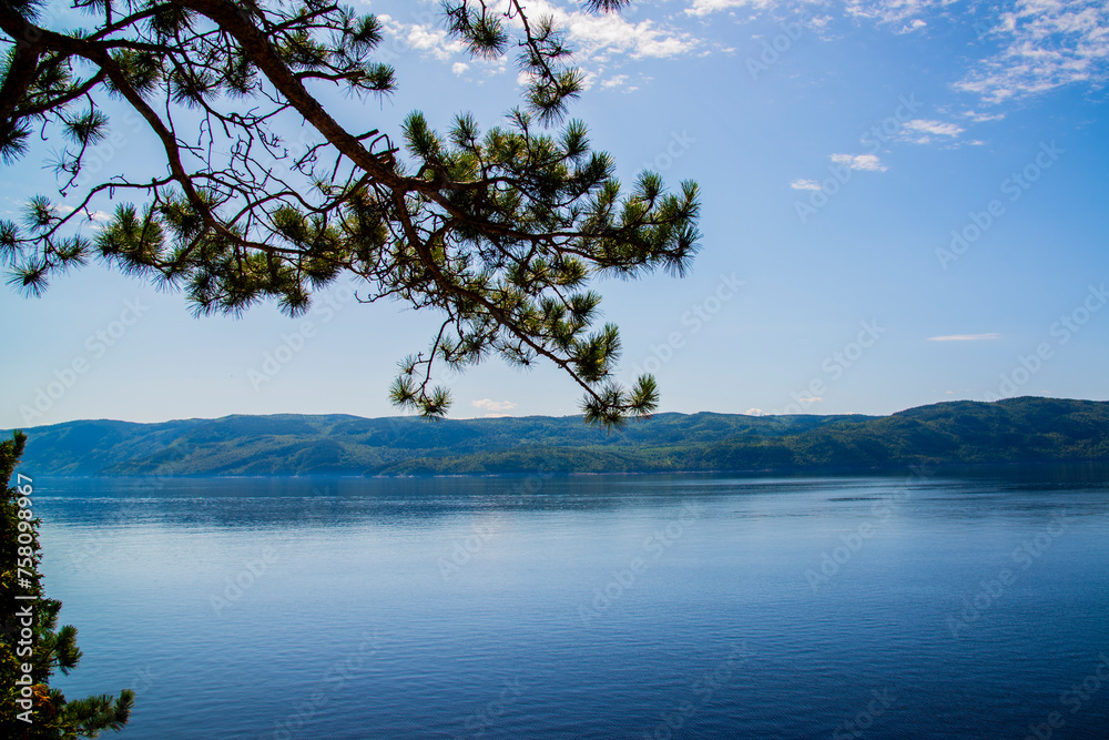 Saint-Rose-du-Nord, Canada - August 14 2019: People kayaking in Petit Saguenay valley view from Sainte-Rose-du-Nord Saint-Rose-du-Nord, Canada - August 14 2019: People kayaking in Petit Saguenay valley view from Sainte-Rose-du-Nord