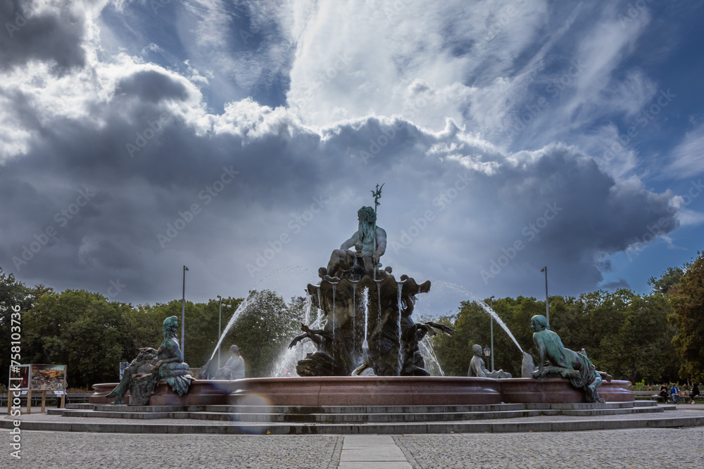 September 2022 -Fountain depicting the Roman god of water, Neptune, & 4 women representing Prussia's main rivers in Berlin, the capital of Germany, Eu