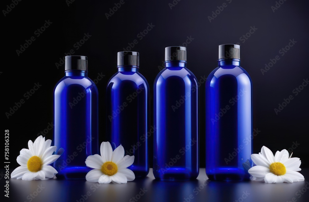 Blue bottles without inscriptions for shampoo on a black background with flowers in backlight with space for text