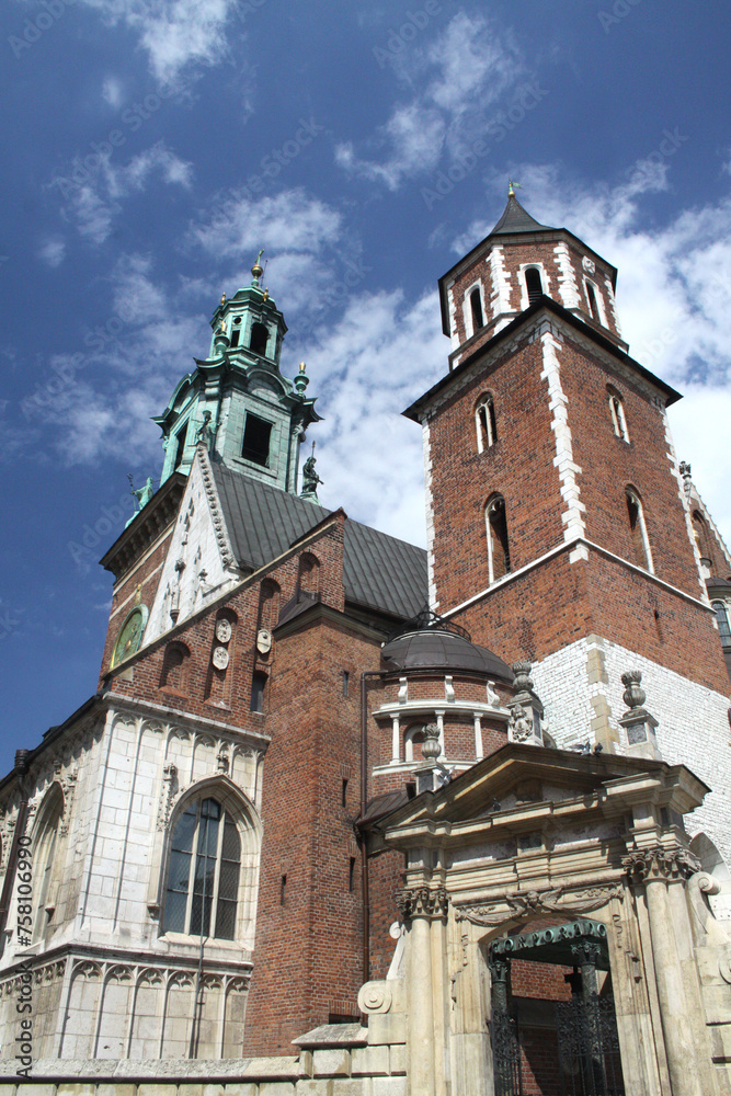 Fototapeta premium Cracow, Malopolska, Poland - 04.26.2013: The view of Wawel royal cathedral towers.