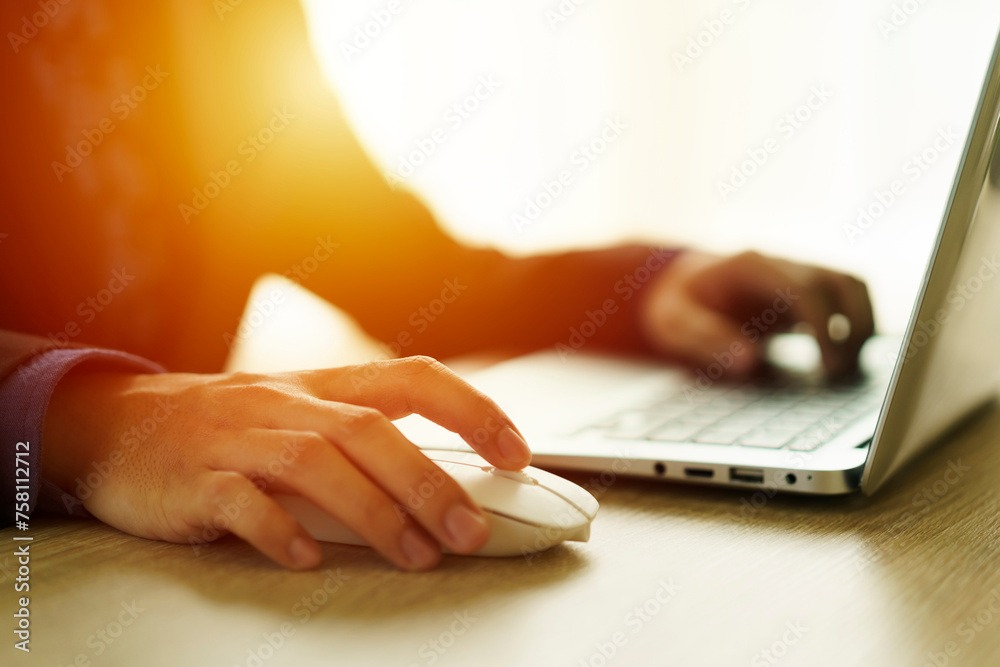 Closeup businessman using computer mouse with computer keyboard Closeup businessman using computer mouse with computer keyboard