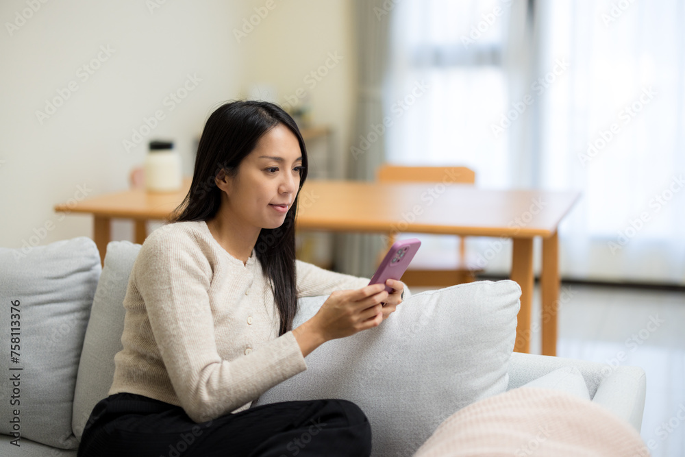 Woman use mobile phone at home Woman use mobile phone at home