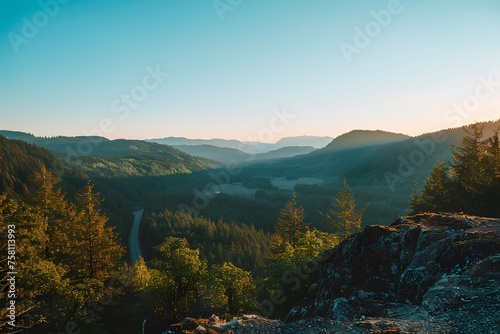 Golden Hour Over Reaction Canyon: A Breathtaking View of Valleys, Forests, and Mountains Under a Clear Blue Sky in Western Washington.